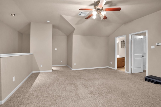 1900 Pagemill Ln, Conroe, TX 77304 - additional living space with vaulted ceiling, light carpet, and a ceiling fan
