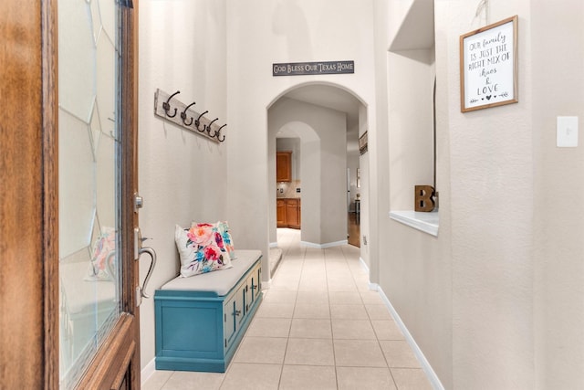 1900 Pagemill Ln, Conroe, TX 77304 - corridor featuring arched walkways and light tile patterned floors