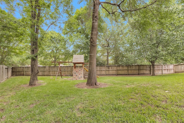 1900 Pagemill Ln, Conroe, TX 77304 - fenced backyard featuring a playground