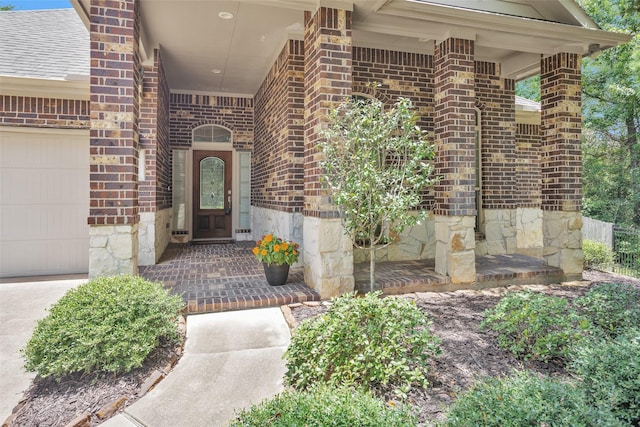 1900 Pagemill Ln, Conroe, TX 77304 - doorway to property featuring brick siding, stone siding, and a garage