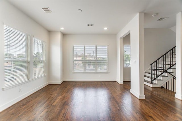 2004 Rosedale St Unit C, Houston, TX 77004 - unfurnished living room featuring healthy amount of natural light, wood finished floors, recessed lighting, and stairway