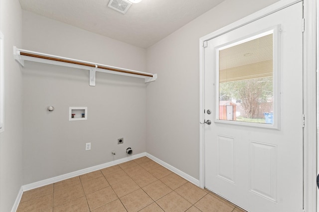14607 Dawn Mist Ct, Magnolia, TX 77354 - laundry room featuring hookup for a gas dryer, hookup for a washing machine, electric dryer hookup, and light tile patterned flooring