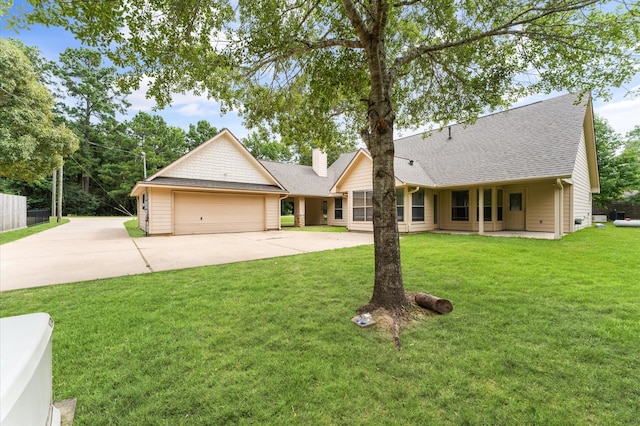 14607 Dawn Mist Ct, Magnolia, TX 77354 - view of front of property featuring concrete driveway, a garage, a front yard, roof with shingles, and a chimney