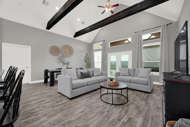 14315 Pecos Ln, Baytown, TX 77523 - living area featuring beamed ceiling, wood finished floors, high vaulted ceiling, and a ceiling fan