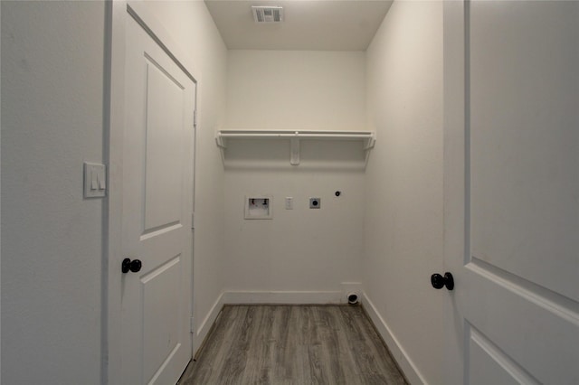 5774 Gineridge Dr, Houston, TX 77053 - washroom featuring electric dryer hookup, dark wood-style floors, and hookup for a washing machine