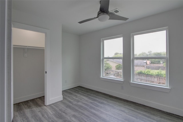 5774 Gineridge Dr, Houston, TX 77053 - unfurnished bedroom with wood finished floors, a ceiling fan, and a closet
