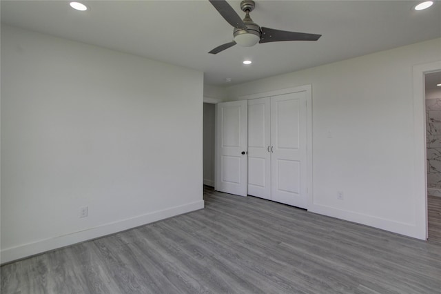 5774 Gineridge Dr, Houston, TX 77053 - unfurnished bedroom featuring recessed lighting, wood finished floors, a closet, ceiling fan, and ensuite bath