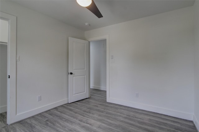 5774 Gineridge Dr, Houston, TX 77053 - unfurnished bedroom featuring wood finished floors and a ceiling fan