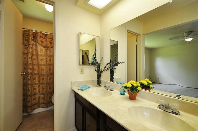 13706 Towneway Dr, Sugar Land, TX 77498 - full bathroom featuring double vanity, tile patterned floors, and ceiling fan