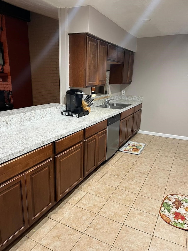 13706 Towneway Dr, Sugar Land, TX 77498 - kitchen with stainless steel dishwasher, light tile patterned floors, and light countertops