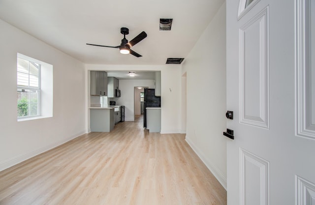 10309 Wiggins St, Houston, TX 77029 - unfurnished living room featuring light wood-style floors and ceiling fan