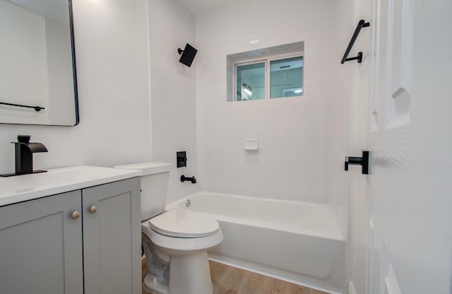 10309 Wiggins St, Houston, TX 77029 - bathroom featuring vanity, wood finished floors, and shower / tub combination