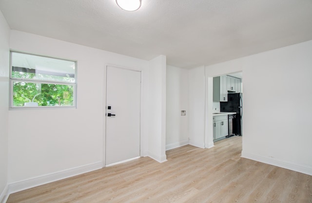 10309 Wiggins St, Houston, TX 77029 - spare room featuring light wood-style floors and baseboards