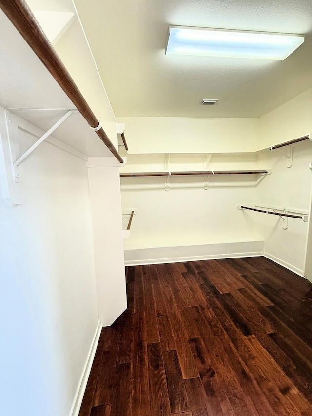 2214 Jurgensen Ln, Sugar Land, TX 77479 - walk in closet with hardwood / wood-style floors