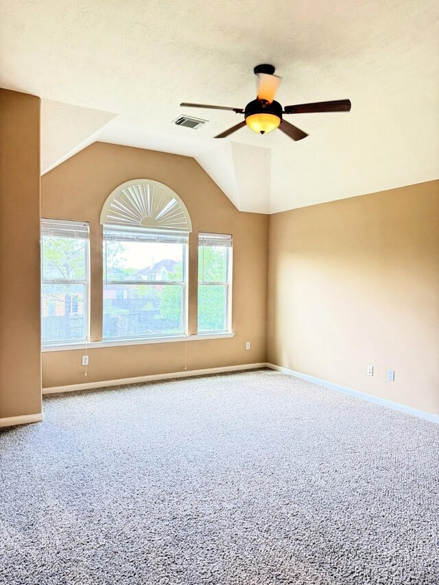 2214 Jurgensen Ln, Sugar Land, TX 77479 - carpeted spare room featuring a ceiling fan, plenty of natural light, and lofted ceiling