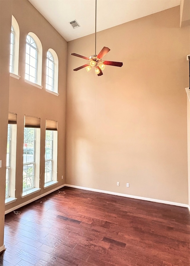 2214 Jurgensen Ln, Sugar Land, TX 77479 - unfurnished room with dark wood finished floors, ceiling fan, and a high ceiling