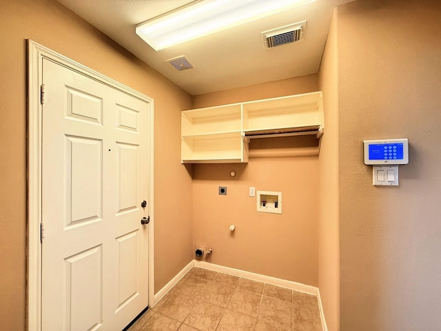 2214 Jurgensen Ln, Sugar Land, TX 77479 - washroom featuring electric dryer hookup, hookup for a gas dryer, hookup for a washing machine, and light tile patterned floors