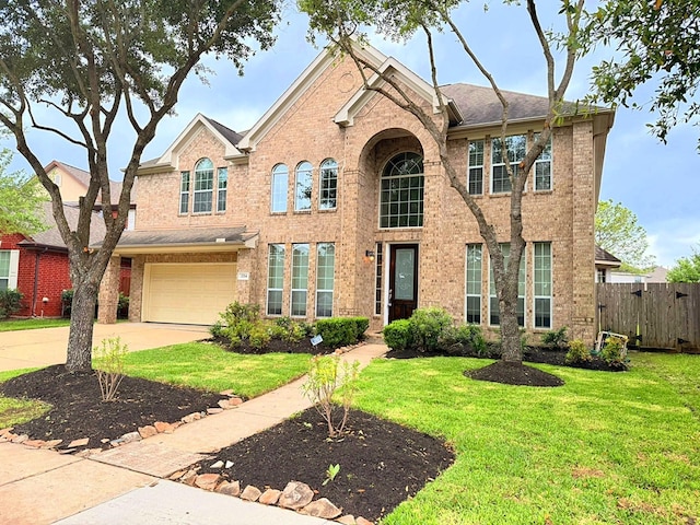 2214 Jurgensen Ln, Sugar Land, TX 77479 - traditional-style home featuring brick siding, driveway, and an attached garage
