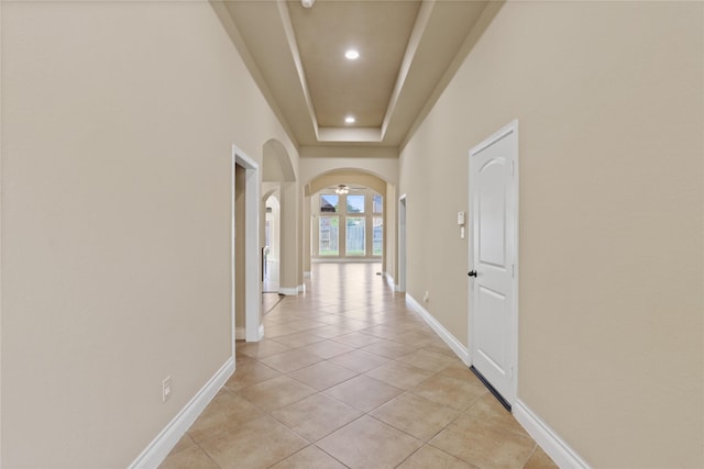 21902 Juniper Wood Ln, Richmond, TX 77469 - corridor featuring light tile patterned floors, arched walkways, and recessed lighting