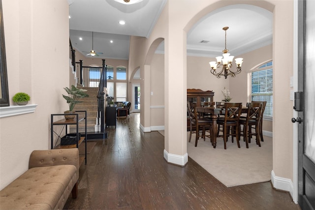31304 New Forest Park Ln, Spring, TX 77386 - entrance foyer with arched walkways, plenty of natural light, wood-type flooring, crown molding, and a chandelier