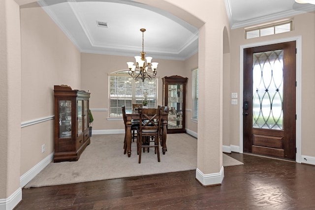 31304 New Forest Park Ln, Spring, TX 77386 - dining room with arched walkways, a chandelier, wood finished floors, and crown molding