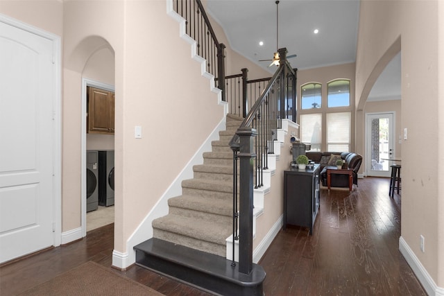 31304 New Forest Park Ln, Spring, TX 77386 - staircase with washing machine and dryer, arched walkways, a ceiling fan, wood-type flooring, and ornamental molding