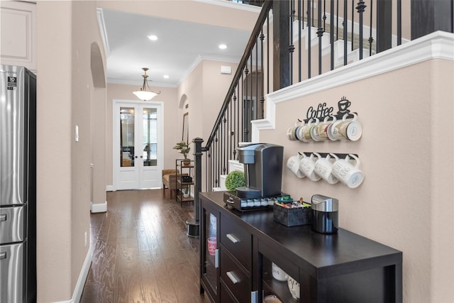 31304 New Forest Park Ln, Spring, TX 77386 - entryway with arched walkways, ornamental molding, dark wood-type flooring, stairs, and recessed lighting