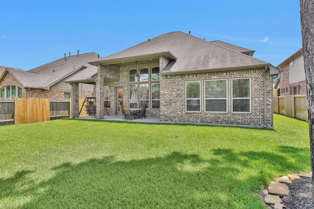 31304 New Forest Park Ln, Spring, TX 77386 - rear view of property with brick siding, a shingled roof, and a fenced backyard