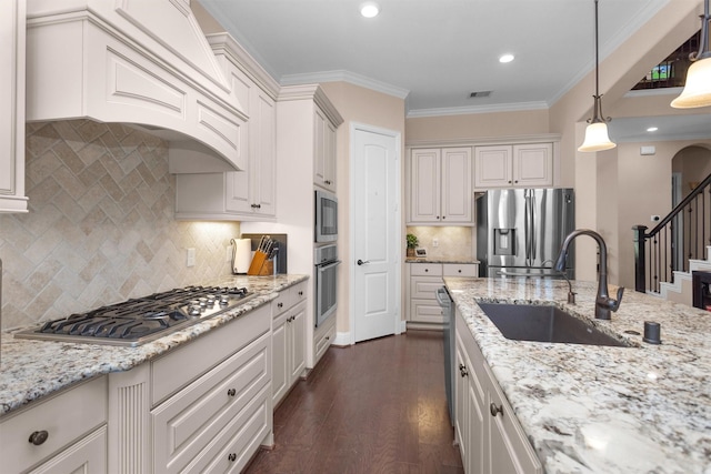 31304 New Forest Park Ln, Spring, TX 77386 - kitchen featuring stainless steel appliances, decorative backsplash, light stone countertops, dark wood-style floors, and recessed lighting