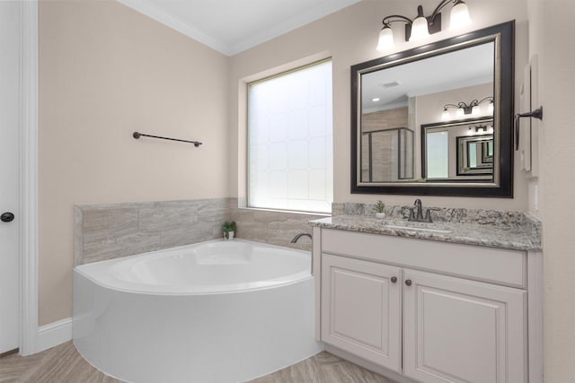 31304 New Forest Park Ln, Spring, TX 77386 - bathroom with vanity, a garden tub, ornamental molding, and tiled shower