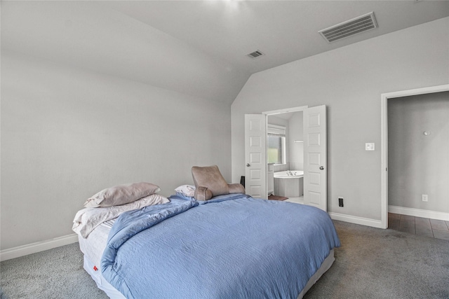 15 Eden Hollow Ln, Richmond, TX 77406 - bedroom featuring carpet, vaulted ceiling, and ensuite bathroom