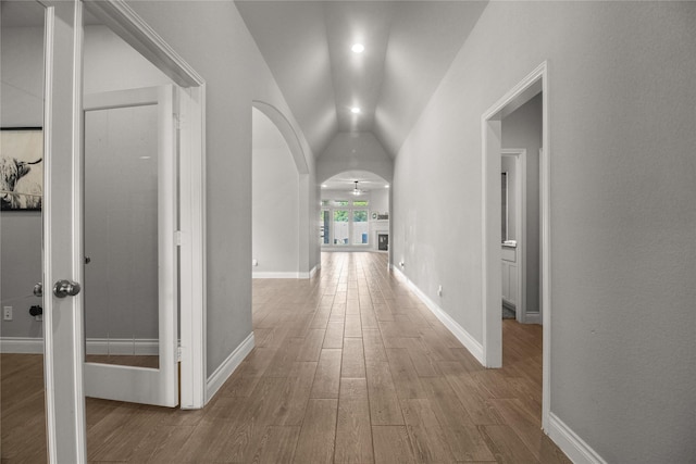 15 Eden Hollow Ln, Richmond, TX 77406 - corridor featuring vaulted ceiling, wood finished floors, and arched walkways