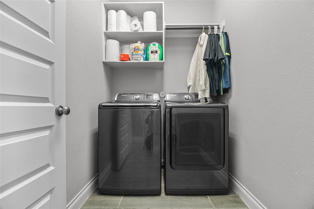 15 Eden Hollow Ln, Richmond, TX 77406 - laundry area with washing machine and dryer and baseboards