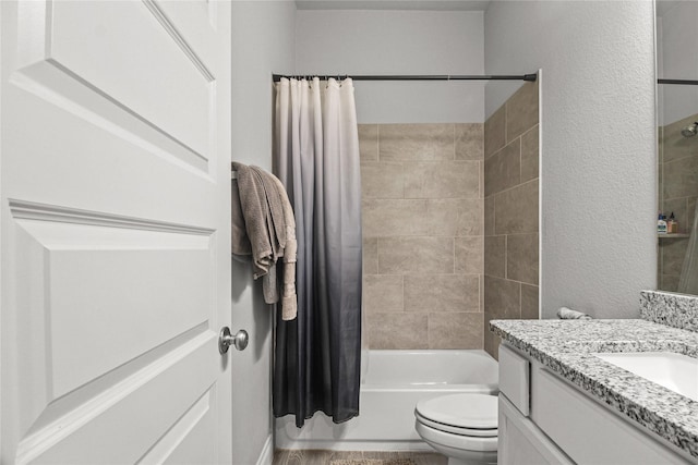 15 Eden Hollow Ln, Richmond, TX 77406 - bathroom featuring vanity, shower / bath combo with shower curtain, and a textured wall