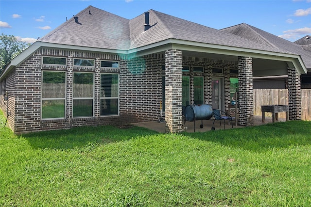 15 Eden Hollow Ln, Richmond, TX 77406 - view of side of home with brick siding, a shingled roof, and a patio area