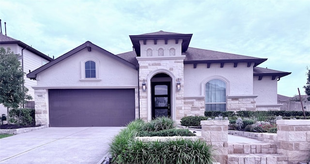 9402 Orchard Trl, Missouri City, TX 77459 - view of front of home with stone siding, stucco siding, a garage, and concrete driveway