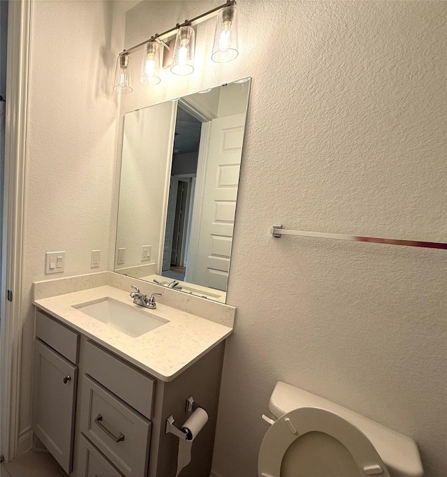 9402 Orchard Trl, Missouri City, TX 77459 - half bath featuring vanity and a textured wall