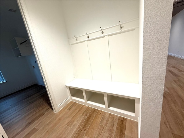 9402 Orchard Trl, Missouri City, TX 77459 - mudroom featuring wood finished floors and baseboards