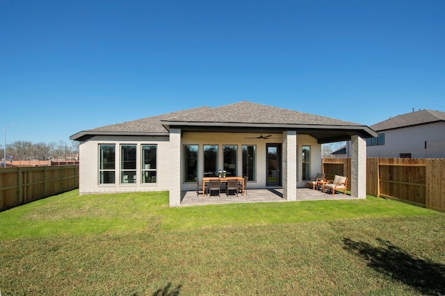 9402 Orchard Trl, Missouri City, TX 77459 - rear view of house with a fenced backyard, a ceiling fan, brick siding, and roof with shingles