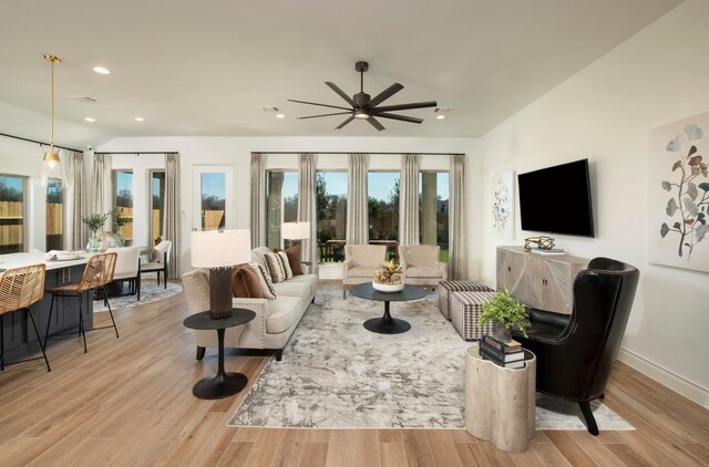 9402 Orchard Trl, Missouri City, TX 77459 - living room with wood finished floors, a ceiling fan, and recessed lighting