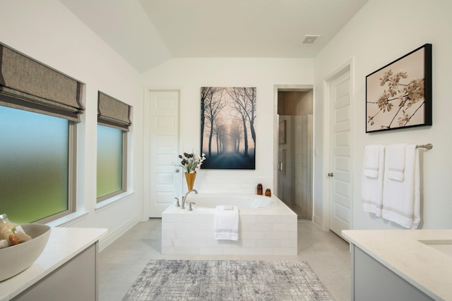 9402 Orchard Trl, Missouri City, TX 77459 - full bathroom featuring vanity, a bath, tile patterned floors, vaulted ceiling, and a shower stall