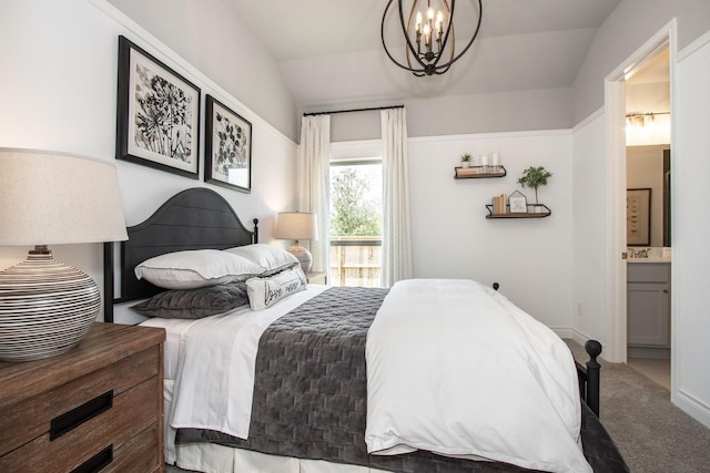 9402 Orchard Trl, Missouri City, TX 77459 - carpeted bedroom featuring vaulted ceiling, a chandelier, and ensuite bathroom
