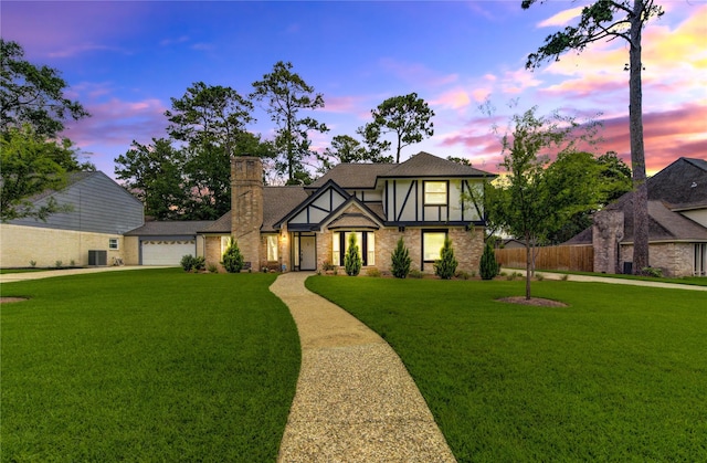 17522 Sorrel Ridge Dr, Spring, TX 77388 - english style home with brick siding, a garage, driveway, a chimney, and roof with shingles