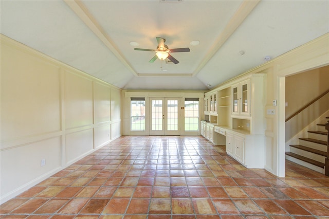 17522 Sorrel Ridge Dr, Spring, TX 77388 - unfurnished living room featuring ceiling fan, lofted ceiling, french doors, stairway, and a decorative wall