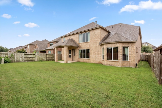 5227 Birch Falls Ln, Sugar Land, TX 77479 - rear view of property with brick siding, a shingled roof, a fenced backyard, and a patio