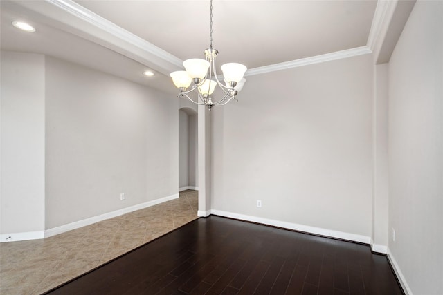 5227 Birch Falls Ln, Sugar Land, TX 77479 - spare room featuring ornamental molding, wood finished floors, recessed lighting, a chandelier, and arched walkways