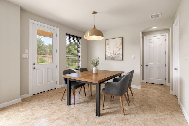5227 Birch Falls Ln, Sugar Land, TX 77479 - dining room with arched walkways and baseboards