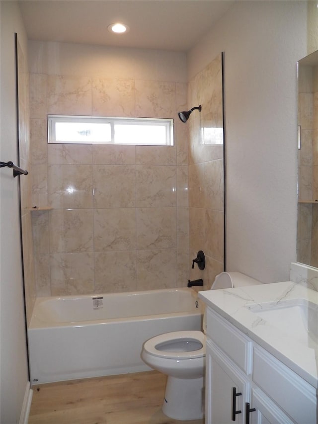 4218 Sorsby Dr, Houston, TX 77047 - bathroom with vanity, shower / bathtub combination, and wood finished floors