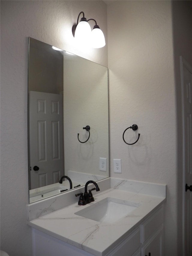 4218 Sorsby Dr, Houston, TX 77047 - bathroom with vanity and a textured wall