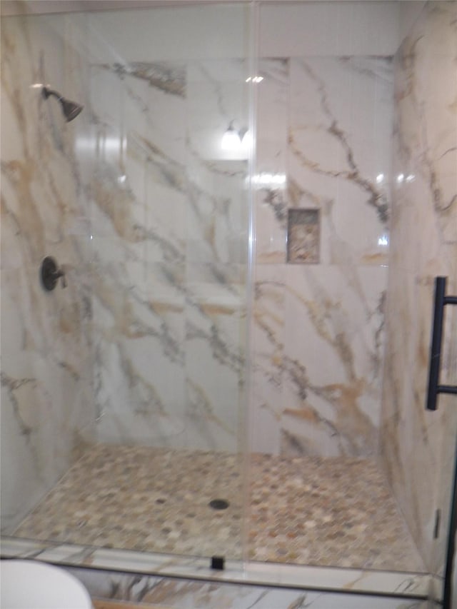 4218 Sorsby Dr, Houston, TX 77047 - full bathroom featuring a marble finish shower and toilet